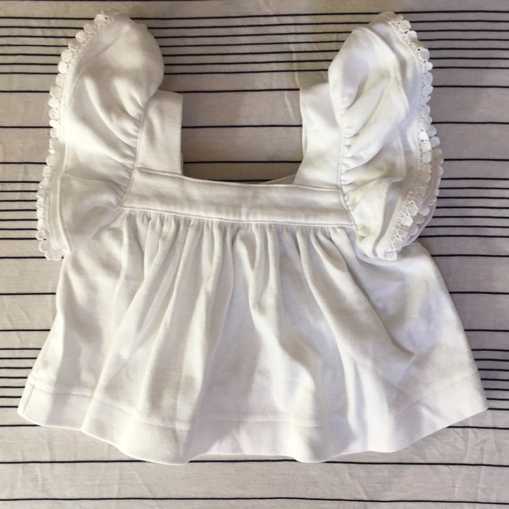 Kelly’s Kids white ruffle sleeve top